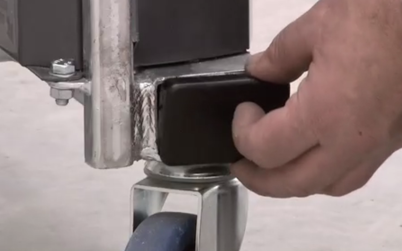 Inserting a plastic end-cap into the frame