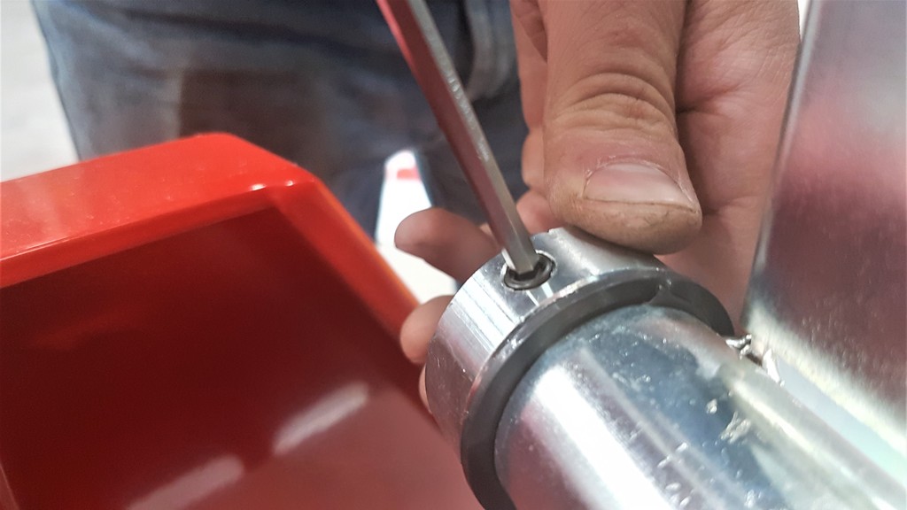 Tightening the lock screw on the shaft collar