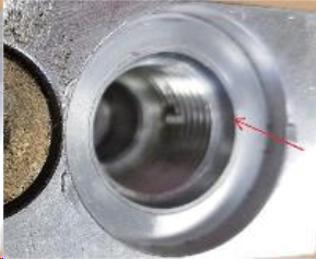 The red arrow shows the edge of the lowering valve cavity, which must form a seal with the o-ring.