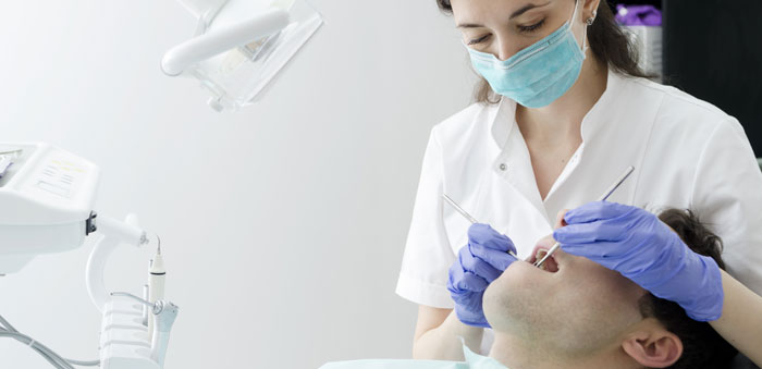 Dentist-and-patient-700x339