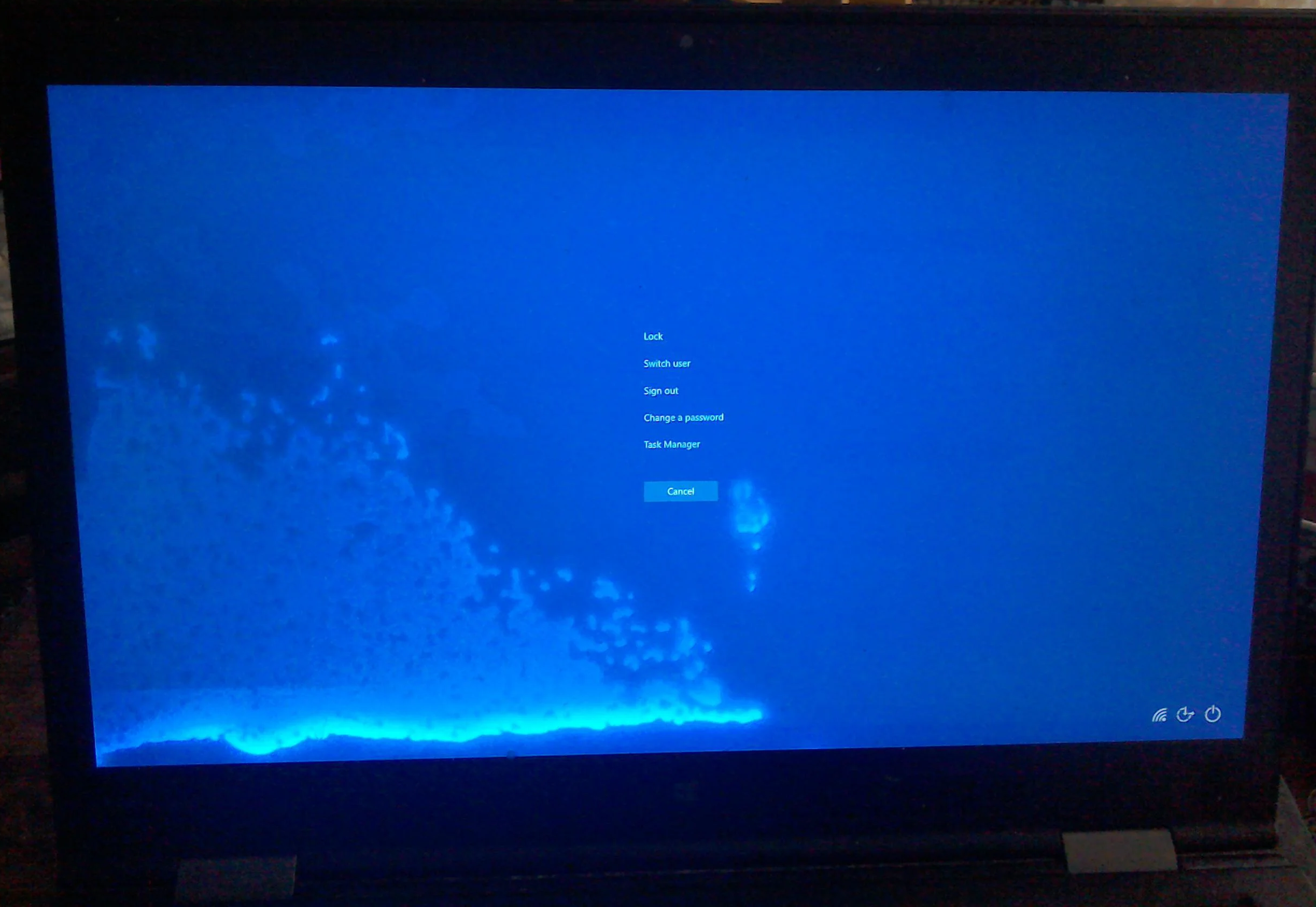 a windows laptop with water spots across the display