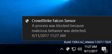 screenshot of a windows pop-up from crowdstrike noting that a malicious process was blocked