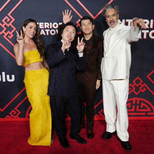 4 actors/actresses/director from Interior china town stand on the red carpet