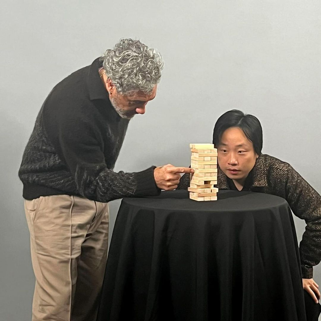 Taika waititi and Jimmy o Yang are playing jenga carefully