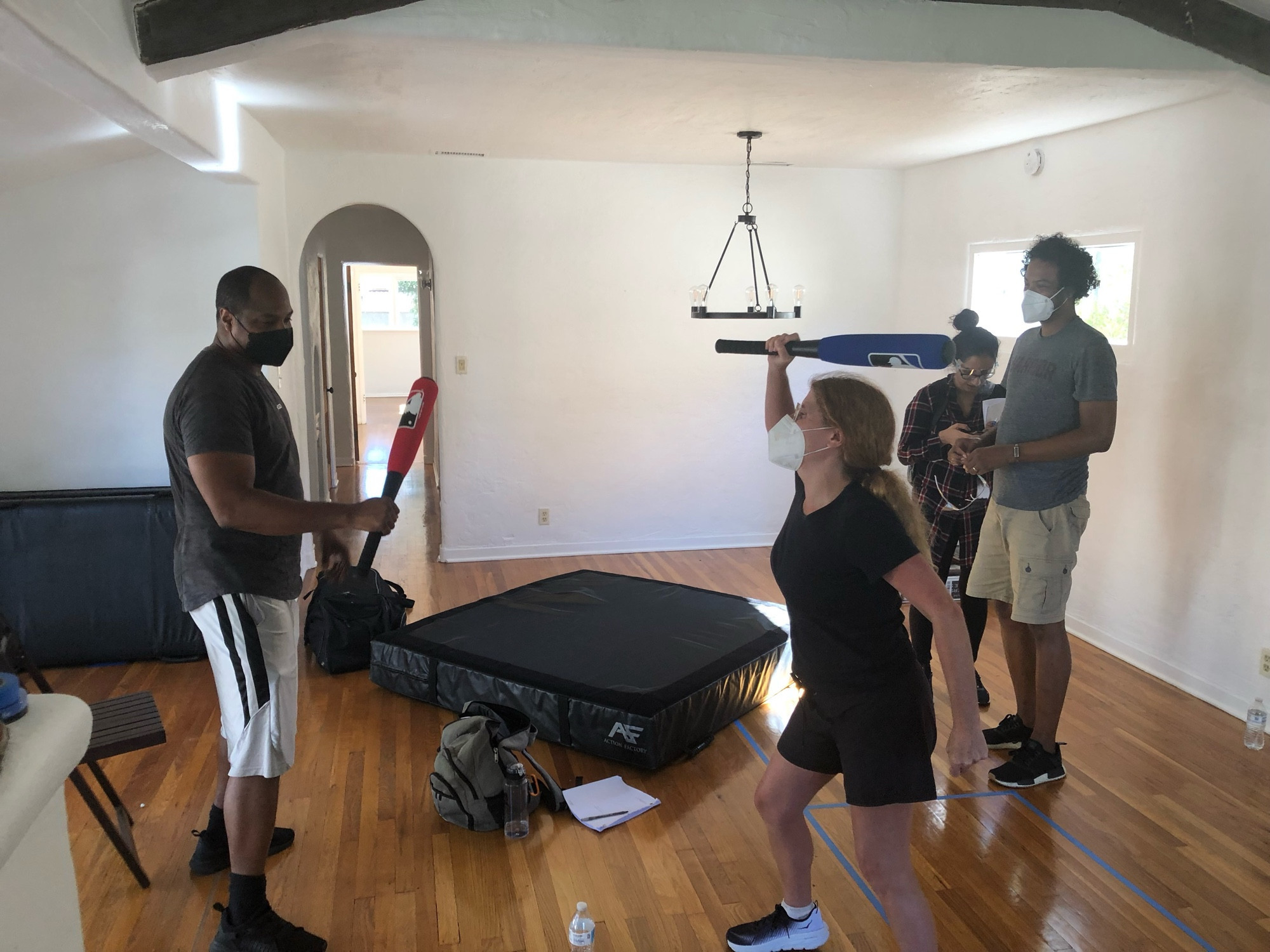 Photo from the same scene, but taken from a different perspective: Samba is now facing the camera as he watches the woman and the man fighting in the foreground.