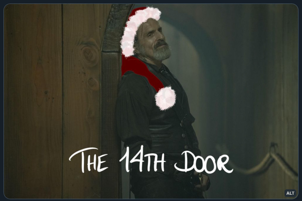 Digitally altered production still of Izzy Hands, from episode 5 of season 2 of Our Flag Means Death.  Izzy is leaning up against the door frame (smiling at Stede off camera), after Stede has relented and let go of the cursed suit.  The image has been digitally altered by drawing a Santa hat on Izzy’s head.  Handwritten text at the bottom of the image reads: “THE 14TH DOOR”.