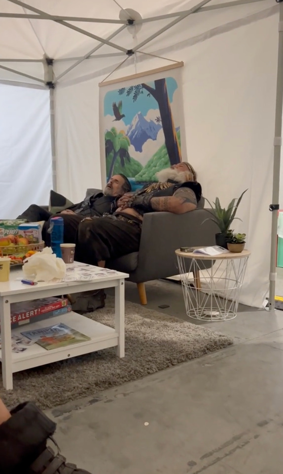 Con O'Neill and David Fane sit on a sofa, napping between takes.