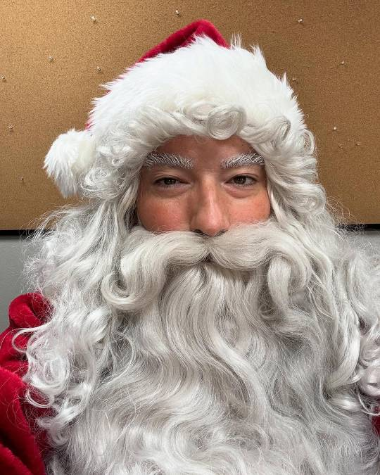 A Santa hat has been added to the eyebrows and beard - Christopher's Santa look is almost complete.