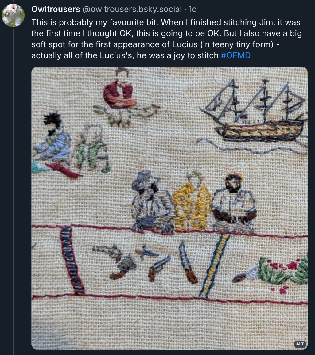 Bluesky post by ‪@ OwlTrousers.bsky.social‬ with a close-up of a part of the tapestry featuring Jim, Stede & Olu, as well as Lucius, Frenchie & Wee John, and the Revenge. The post reads: This is probably my favourite bit. When I finished stitching Jim, it was the first time I thought OK, this is going to be OK. But I also have a big soft spot for the first appearance of Lucius (in teeny tiny form) - actually all of the Lucius's, he was a joy to stitch. # OFMD. 