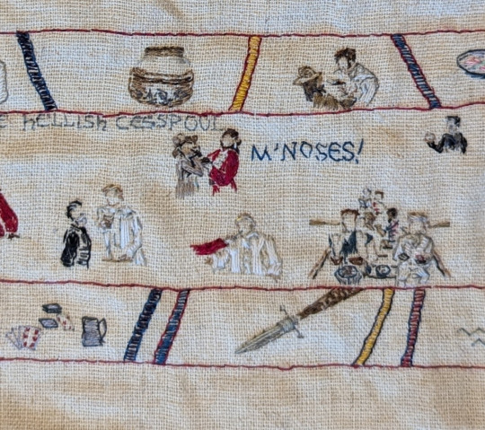 Close up photo: Izzy & Stede talking, Spanish Jackie holding a knife to Jim's throat with the quote 'My noses!' embroidered next to her, Jackie's arm holding a knife to Stede's nose, and Stede, his crew & Geraldo sitting in a rowboat, holding various tapas dishes.