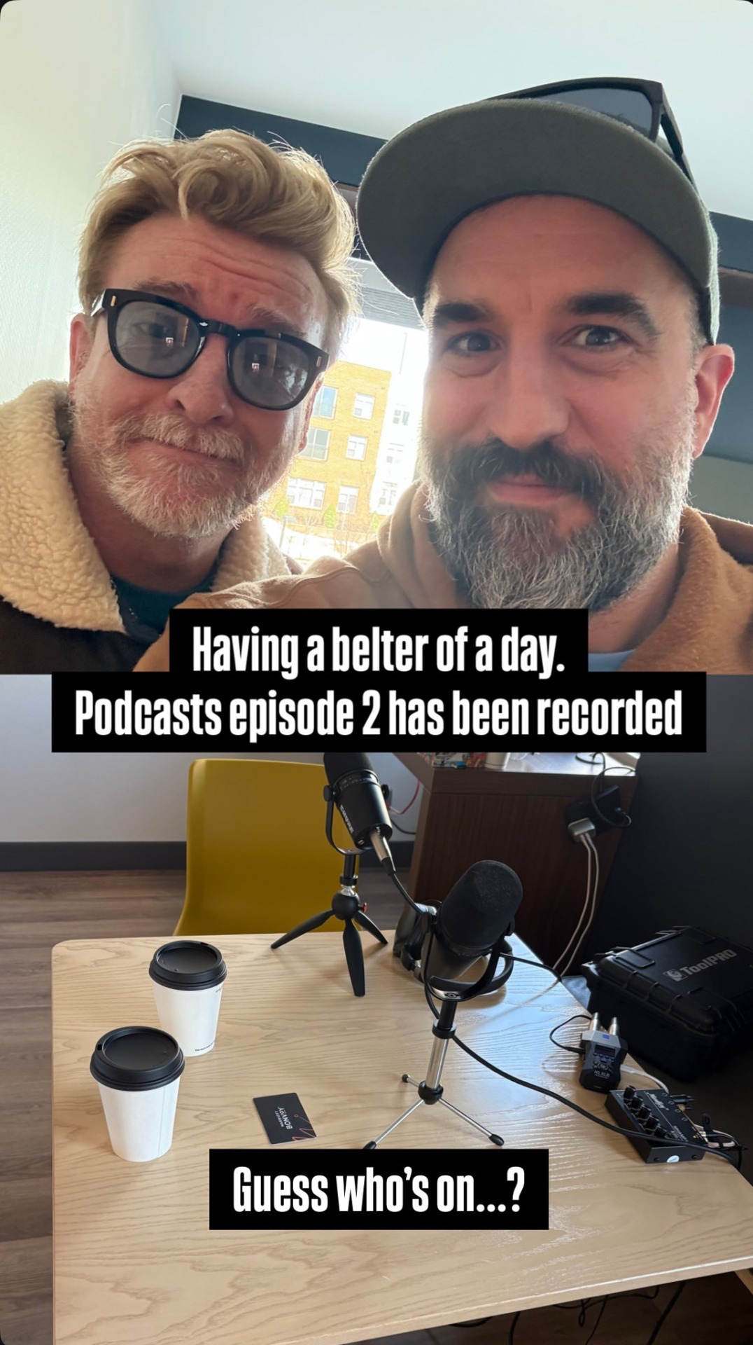 Two photos: At the top is a picture of Rhys Darby standing next to Steve Wrigley. Rhys is wearing blue tinted glasses and a leather pilot's jacket, curly blond hair and a grey and red beard. Steve wears a black hat with sunglasses and black and white beard. They are both smiling. Second picture shows audio recording equipment on a desk, and white coffee cups with black tops. There is a black text box with white text that says 'Having a belter of a day. Podcasts episode 2 has been recorded.' Another line says 'Guess who's on ...?' 