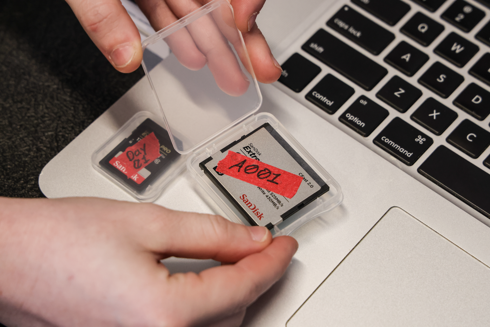 CFast2.0 card with red tape labeled A001 in a case.