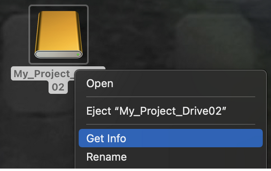 Right clicking on the external drive on desktop. Get Info is selected in the menu.