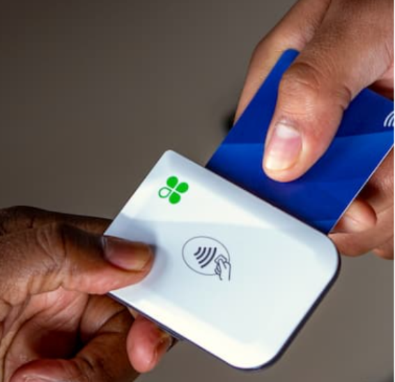 A person holding a credit card AI-generated content may be incorrect.