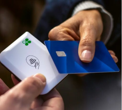 A person holding a card AI-generated content may be incorrect.