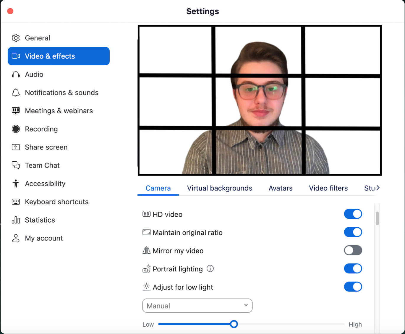 In the Video & Effects tab in the Zoom Desktop App, HD Video is on. Maintain original ratio is on. Mirror my video is off. Portrait lighting is on. Adjust for low light is set to manual and the slider is adjusted appropriately. 